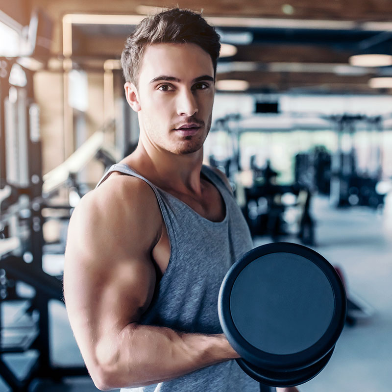 Male posing with dumbells